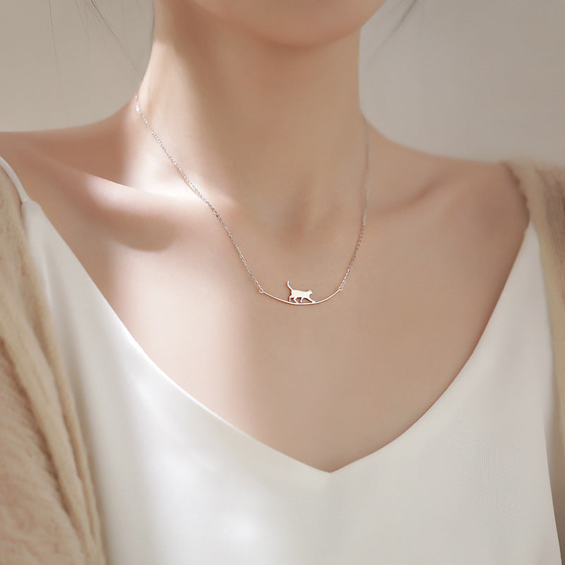 Silver Pendant Necklace Featuring a Playful Kitten