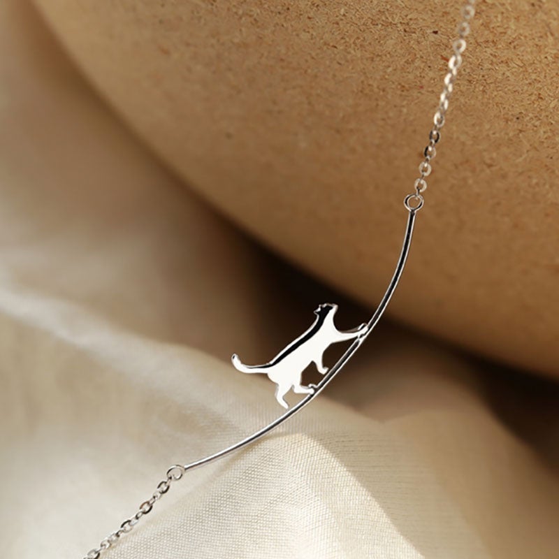 Silver Pendant Necklace Featuring a Playful Kitten