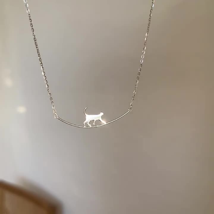 Silver Pendant Necklace Featuring a Playful Kitten